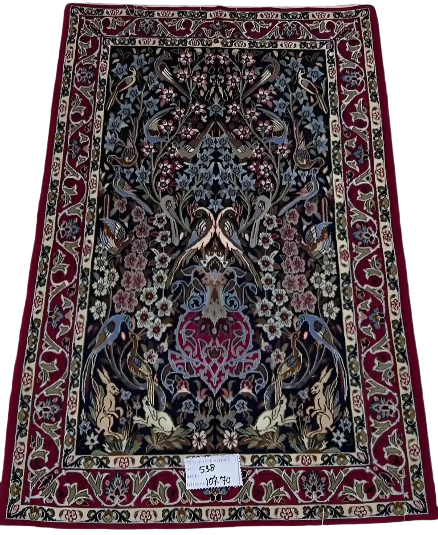 "Hand-knotted Persian rug from Isfahan, made with wool and silk. This luxury rug measures approximately 107 cm x 70 cm (3.5 x 2.3 feet) and features intricate floral and bird designs with a knot density of 810,000 knots per square meter. Perfect for adding sophistication to living spaces."